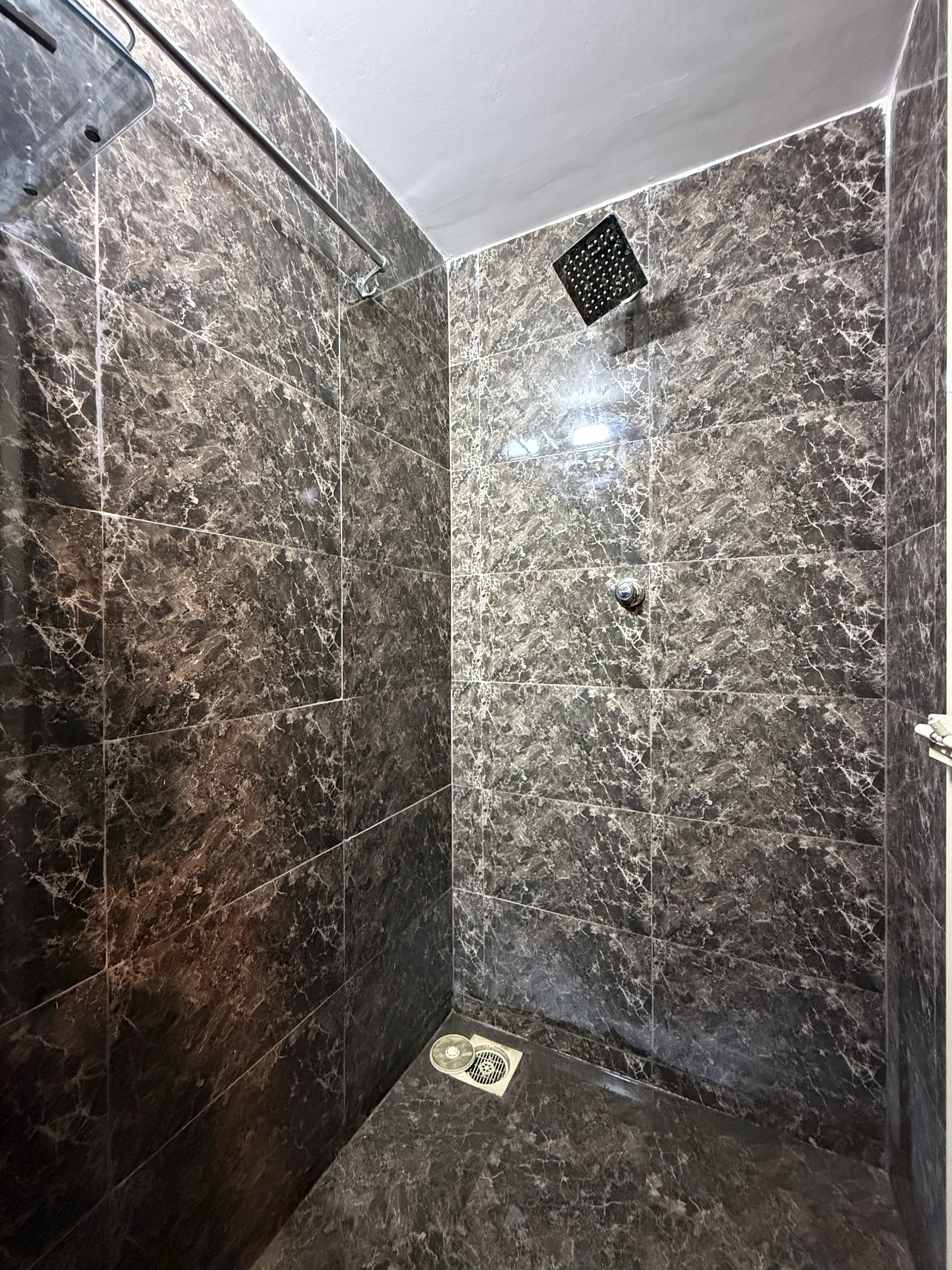 Clean private shower cubicles at The Unity Fitness